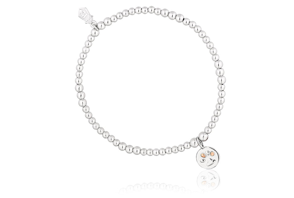 A Clogau Paw Print Affinity Beaded Bracelet 3SBB50S with a smiley face charm.