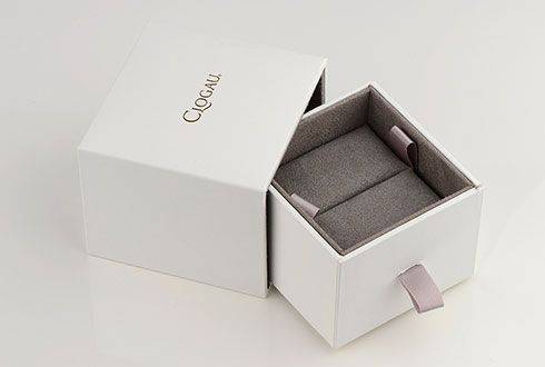 A white box with a Clogau Men’s Dragon Scale Ring 3SDSSR inside.