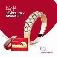 A CONNOISSEURS JEWELLERY WIPES and a card with the words make your jewellery sparkle.
