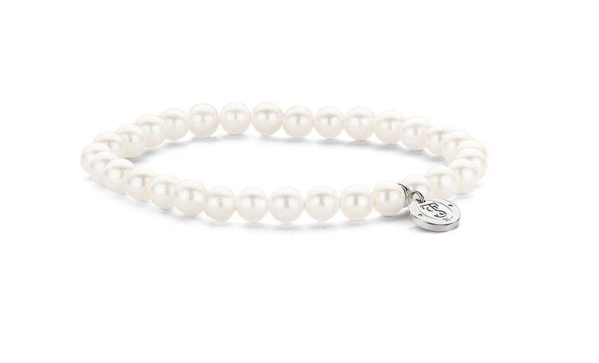 A Pearl Bracelet with a charm on it.