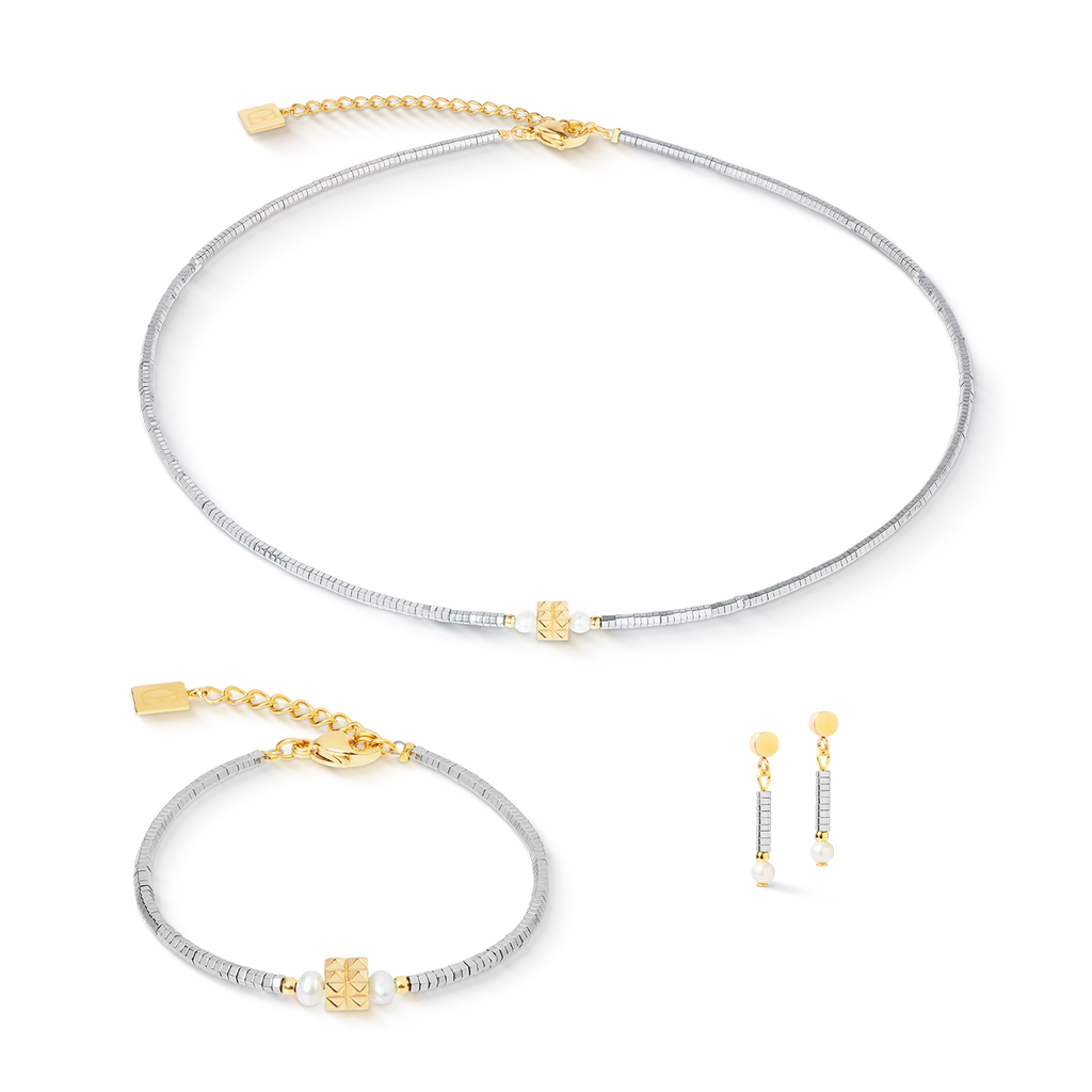 The Couer De Lion Bracelet Edge & Grace silver-gold features a matching handcrafted jewelry set with a silver-gold bracelet, necklace, and gold-accented drop earrings, beautifully presented on a white background.