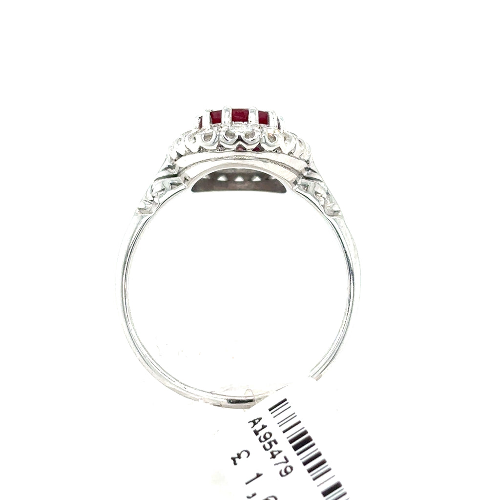 Side view of a Ruby & Diamond Cluster Halo Set Dress Ring in 9ct white gold, showcasing intricate details and a white price tag.