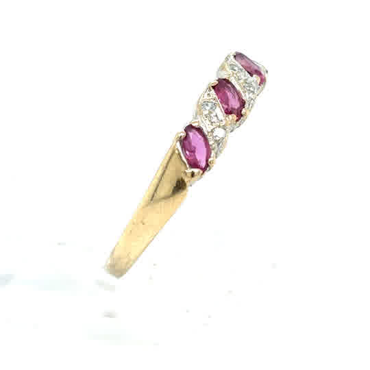Pre-loved Ruby & Diamond Half Eternity Dress Ring in 9ct yellow gold, showcasing three oval rubies and sparkling diamonds set diagonally along the band.