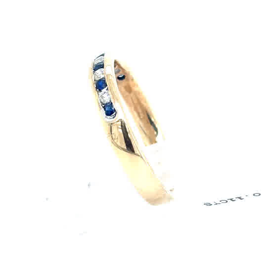 The Sapphire & Diamond Half Eternity Dress Ring in 9ct yellow gold features alternating blue sapphires and clear diamonds set in a row along the band, shown against a white background.