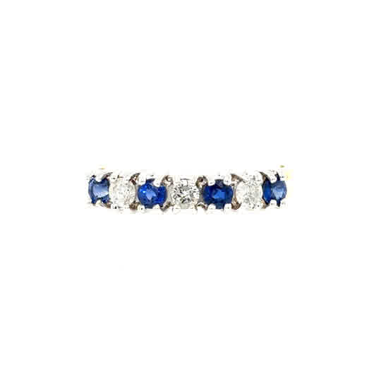 The Sapphire & Diamond Half Eternity Ring in 18ct yellow gold features a straight row of alternating blue sapphires and clear diamonds.