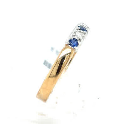 The Cym Welsh Gold Diamond and Sapphire Half Eternity Ring features a decorative gold band set with two blue sapphires and three clear diamonds arranged elegantly on top.