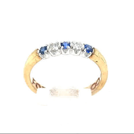 The Cym Welsh Gold Diamond and Sapphire Half Eternity Ring showcases alternating blue sapphires and sparkling diamonds set in a gold band.