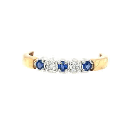 The Cym Welsh Gold Diamond and Sapphire Half Eternity Ring features alternating blue sapphires and diamonds set in a stunning row along the band.