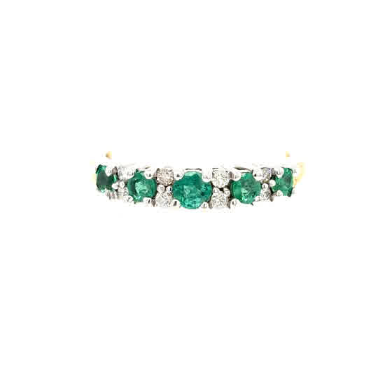 The Emerald and Diamond Half Eternity Ring in 9ct yellow gold features alternating round green emeralds and small white diamonds set in a row on the band.