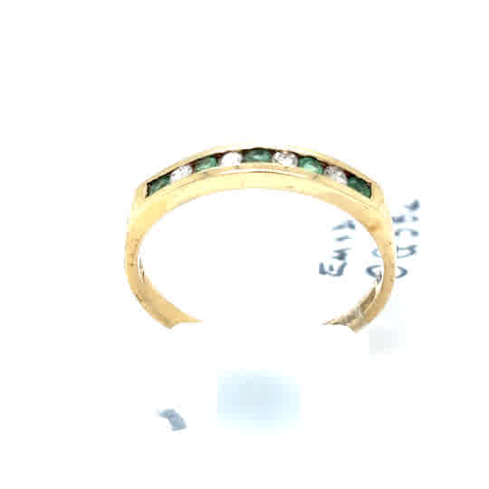 The Pre-Loved Emerald and Diamond Half Eternity Ring in 9ct yellow gold showcases alternating green emeralds and clear diamonds set in a row along the band, photographed against a white background.