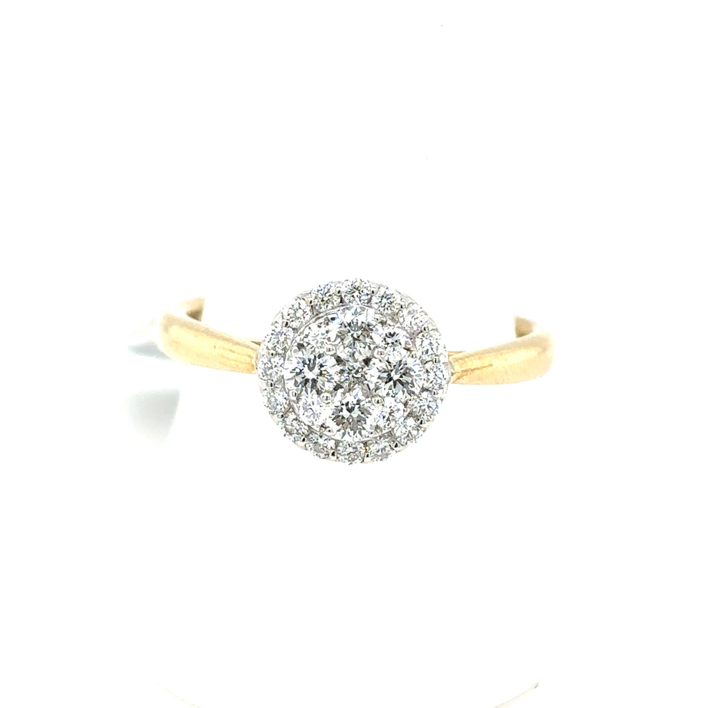 The Starburst Canadian Diamond Round Engagement Ring features a stunning circular cluster of ethically-sourced Canadian diamonds set in 9ct yellow gold.