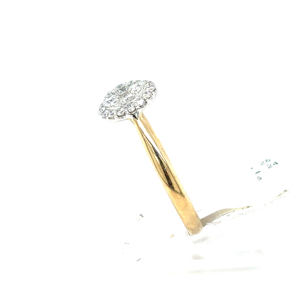 The Starburst Canadian Diamond Round Engagement Ring in 9ct Yellow Gold showcases ethically-sourced Canadian diamonds in a radiant circular cluster, beautifully displayed against a white background.