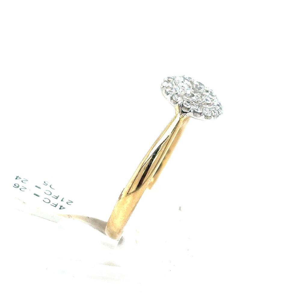 The Starburst Canadian Diamond Round Engagement Ring in 9ct Yellow Gold features ethically-sourced diamonds in a round cluster, shown against a white background.