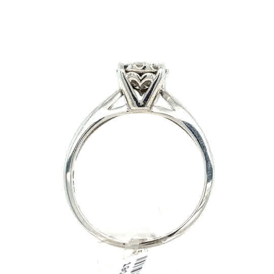 The Starburst Canadian Diamond Cluster Ring in 9ct white gold features ethically-sourced Canadian diamonds arranged in a cluster design, displayed from the side on a white background.