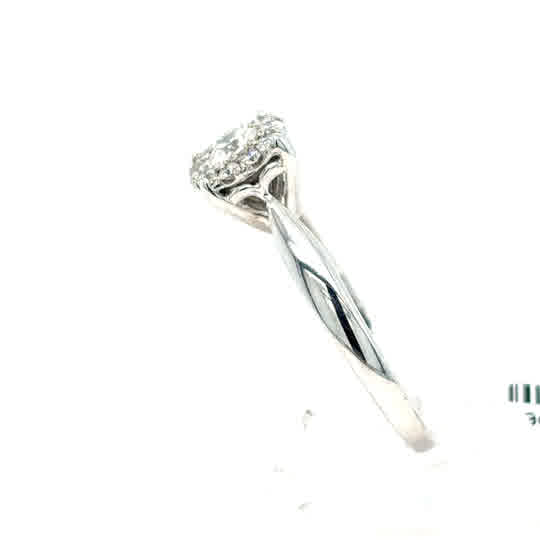 A Starburst Canadian Diamond Cluster Ring in 9ct white gold, featuring ethically-sourced Canadian diamonds, displayed on a white background.