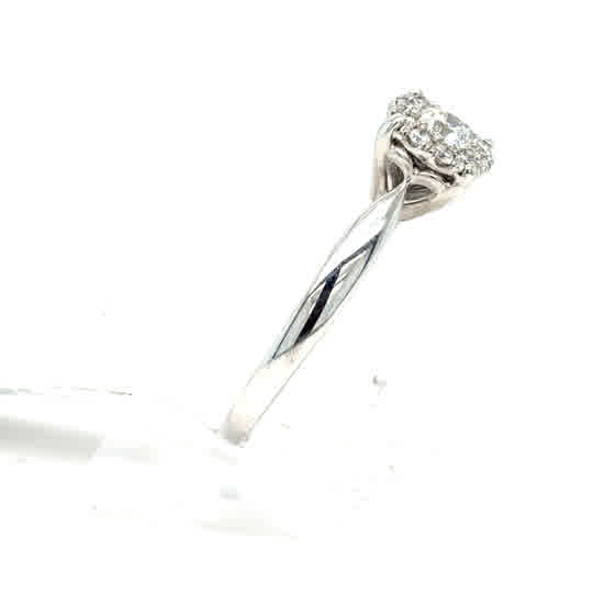 The Starburst Canadian Diamond Cluster Ring features a twisted 9ct white gold band and a raised round cluster of ethically-sourced Canadian diamonds.