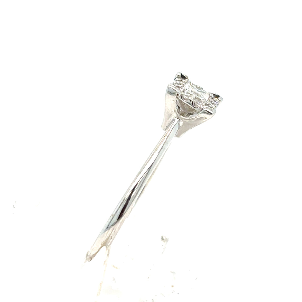 A 9ct white gold Starburst Canadian Diamond Princess Cut Engagement Ring is shown from the side on a white background, featuring a stunning princess-cut diamond in a sleek setting.