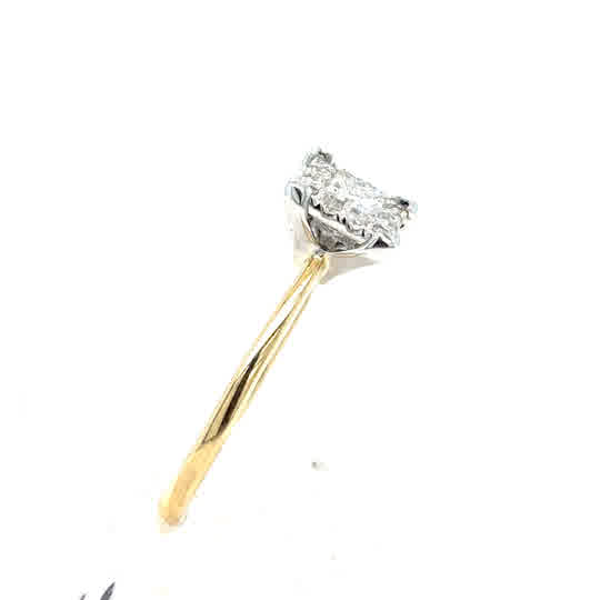 The Starburst Canadian Diamond Princess Cut Cluster Engagement Ring features princess-cut diamonds set in a cluster on 9ct yellow gold—a timeless choice for an engagement ring.