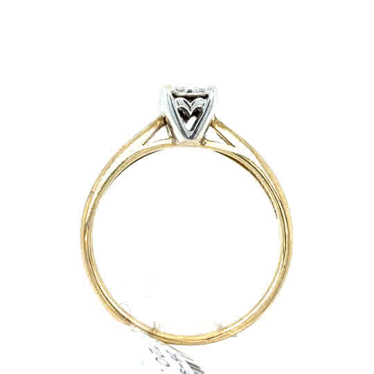 The Starburst Canadian Diamond Cluster Engagement Ring in 9ct yellow gold features a cluster of Canadian diamonds set in white gold prongs, with a heart-shaped detail beneath the stones visible from the side.