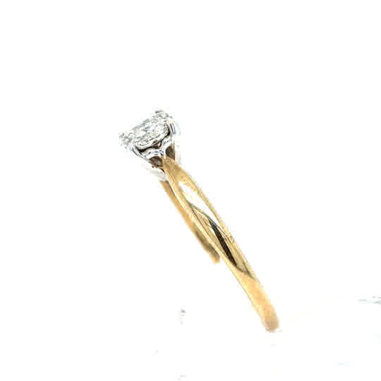 The Starburst Canadian Diamond Cluster Engagement Ring in 9ct yellow gold features sparkling diamonds in a cluster setting on a plain band, displayed against a white background.
