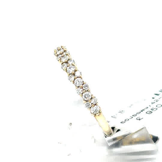 The Starburst Canadian Diamond Half Eternity Ring in 9ct yellow gold features a single row of sparkling round diamonds, elegantly displayed on a white stand.