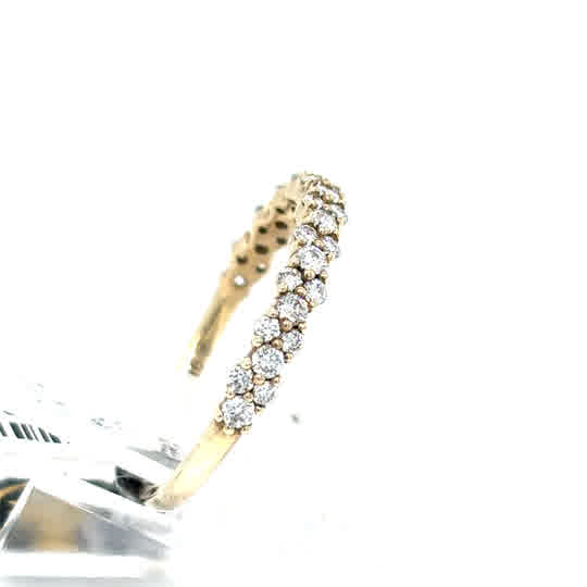 The Starburst Canadian Diamond Half Eternity Ring in 9ct yellow gold features a row of small round white diamonds set along the band, shown against a white background.
