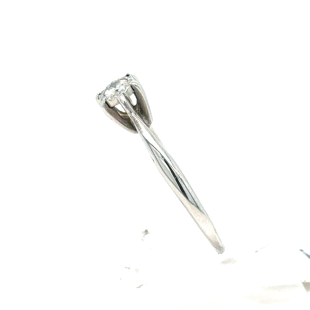 The Pre-loved Solitaire Diamond Engagement Ring in 9ct white gold features a single round diamond in a raised prong setting, shown from the side against a white background.