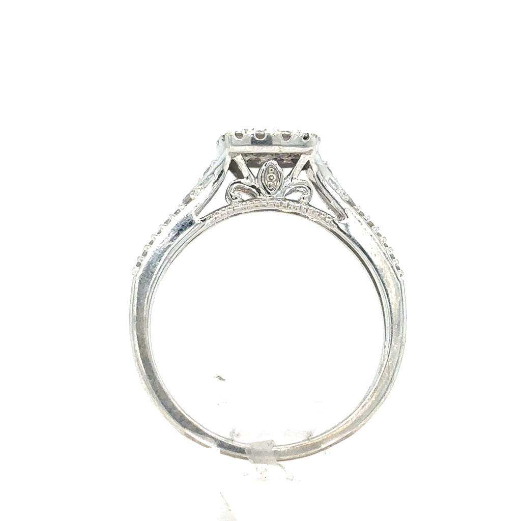 Side view of the Pre-loved Diamond Cluster Engagement Ring in 9ct white gold, showcasing intricate filigree and a raised diamond cluster setting, photographed on a white background.
