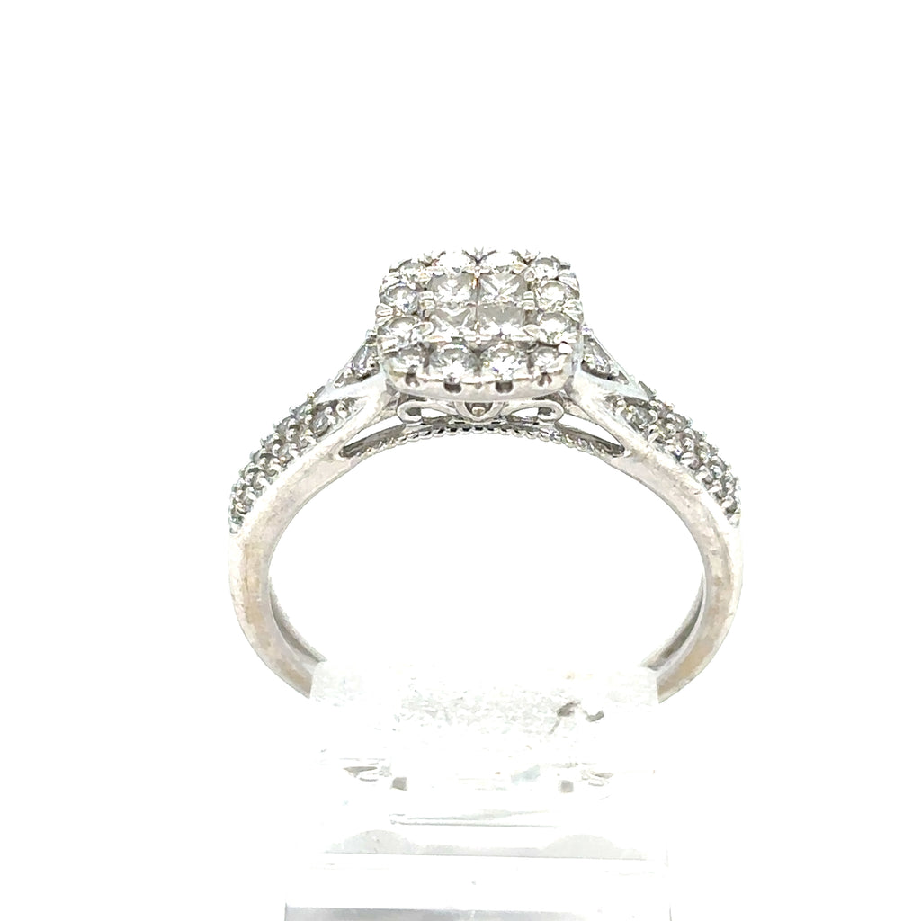 The Pre-loved Diamond Cluster Engagement Ring in 9ct white gold features a square diamond cluster atop and extra diamonds along the band, shown against a white background.
