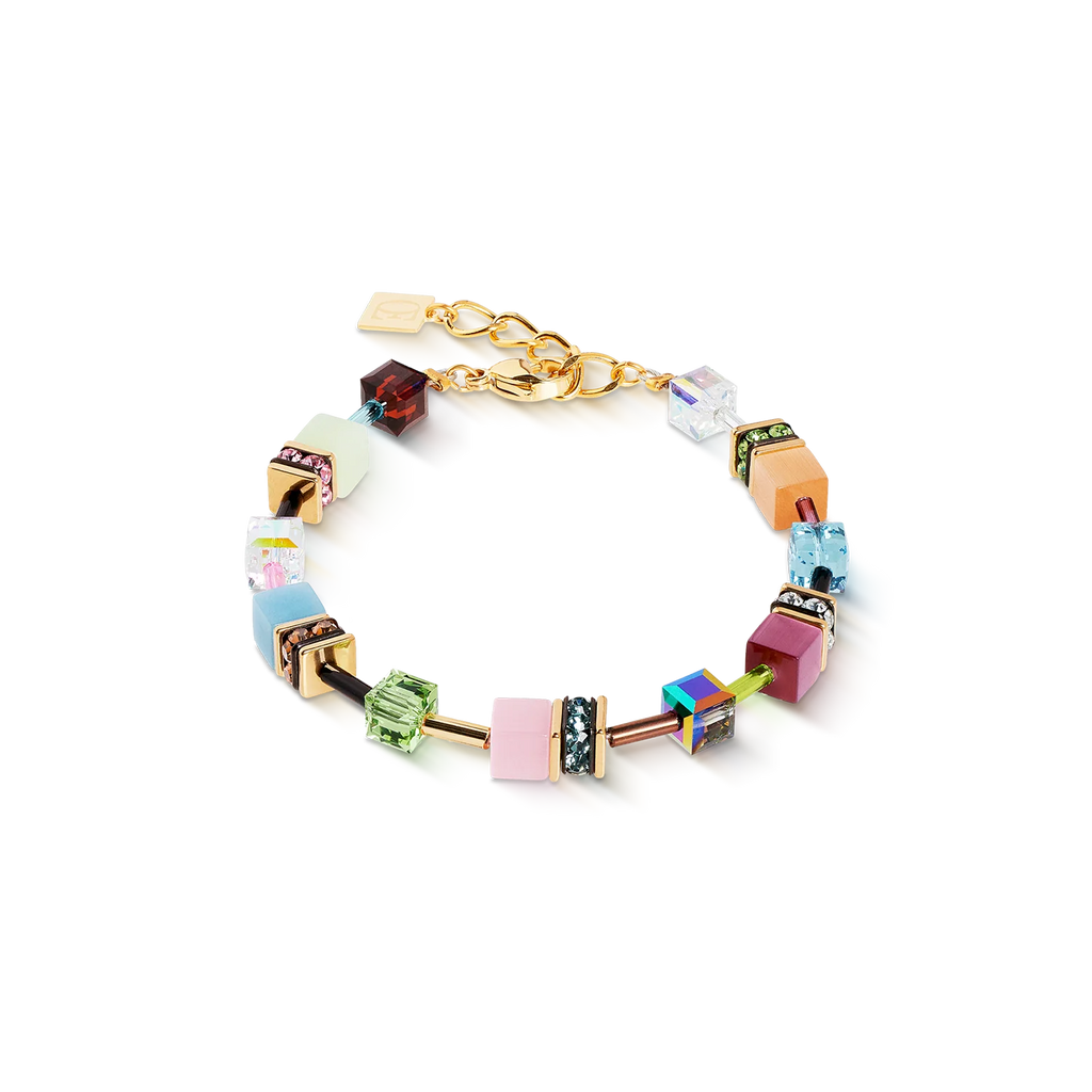 The Couer De Lion GeoCUBE® Iconic bracelet Art Nouveau gold features colorful geometric beads and rhinestone accents on a gold chain, displaying exquisite handmade jewellery on a white backdrop.