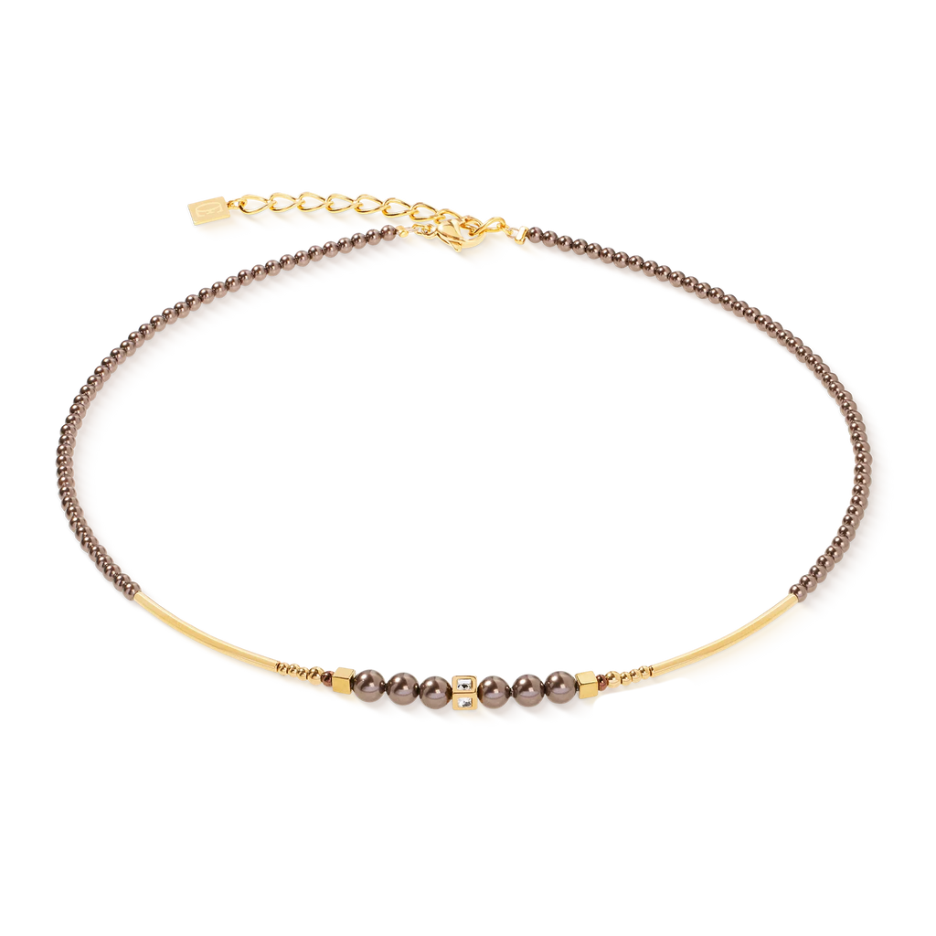 The Coeur de Lion Necklace Shimmering Princess Pearls gold-brown features dark beads, subtle gold accents, and an adjustable clasp, all handmade in Germany and showcased against a white background.