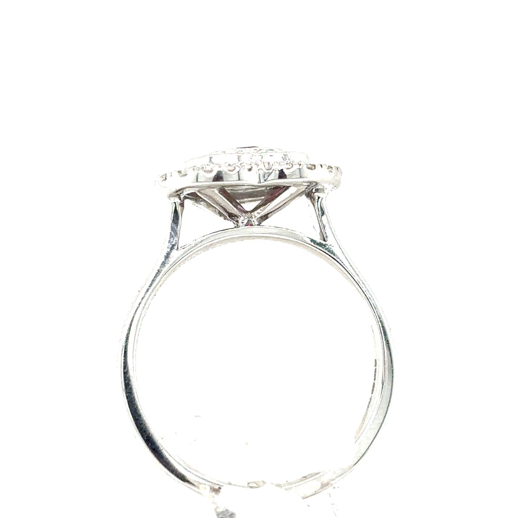 A side view of the Ruby & Diamond Heart Cluster Dress Ring in 9ct white gold, featuring a raised heart-shaped setting with a central ruby surrounded by sparkling diamonds.