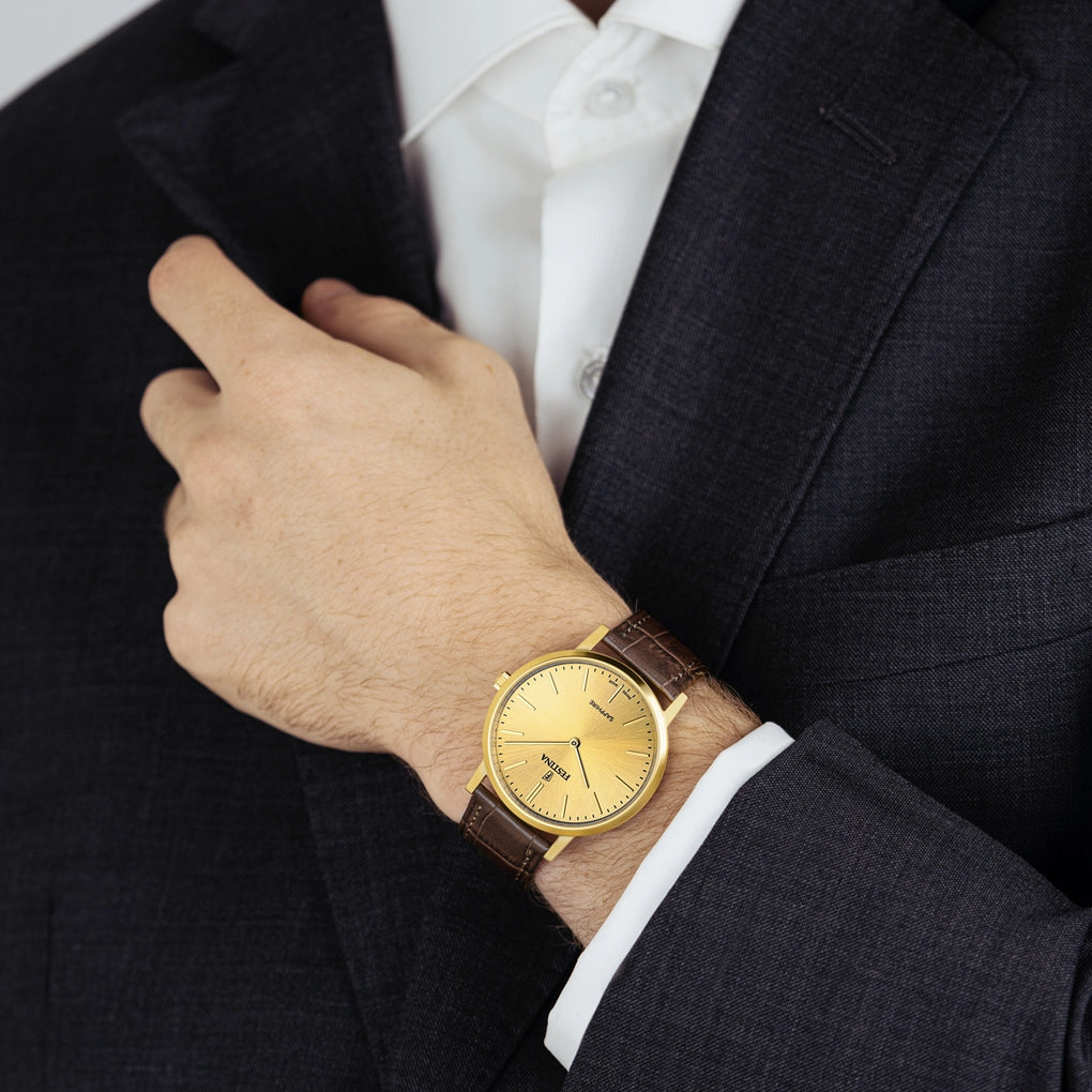 A person in a dark suit adjusts their cuff, highlighting the Festina Men's Champagne Dial Watch with a leather strap, model F20016/2—Swiss Made.