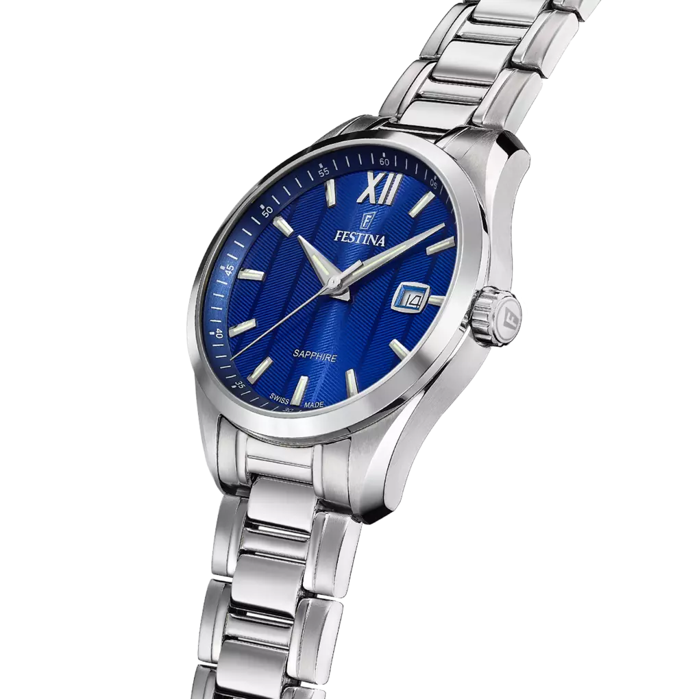 The Festina Men's Blue Dial Watch F20026/2 features a stainless steel strap, silver hour markers, and a date window at 3 o’clock. Swiss made. Shown on a white background.