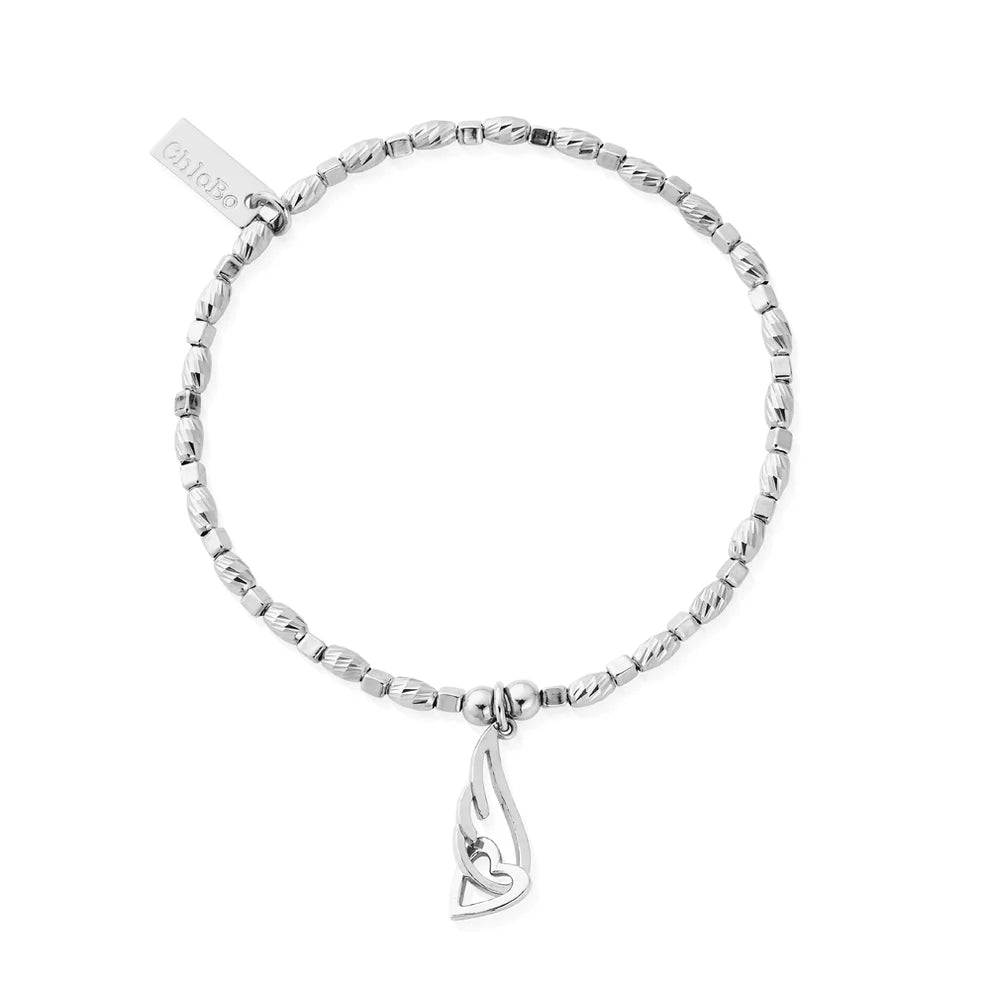 The ChloBo Soul Glow Interlocking Heart & Angel Wing Bracelet features a dangling wing charm and a rectangular tag, making it a meaningful piece of guardian angel jewelry.