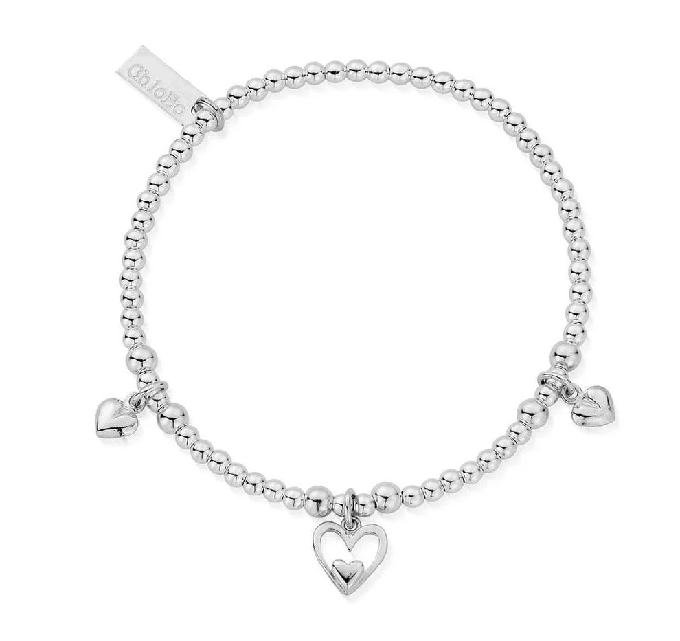 The ChloBo Triple Heart Bracelet is a stylish silver beaded design with three heart-shaped charms and a rectangular "ChloBo" tag.