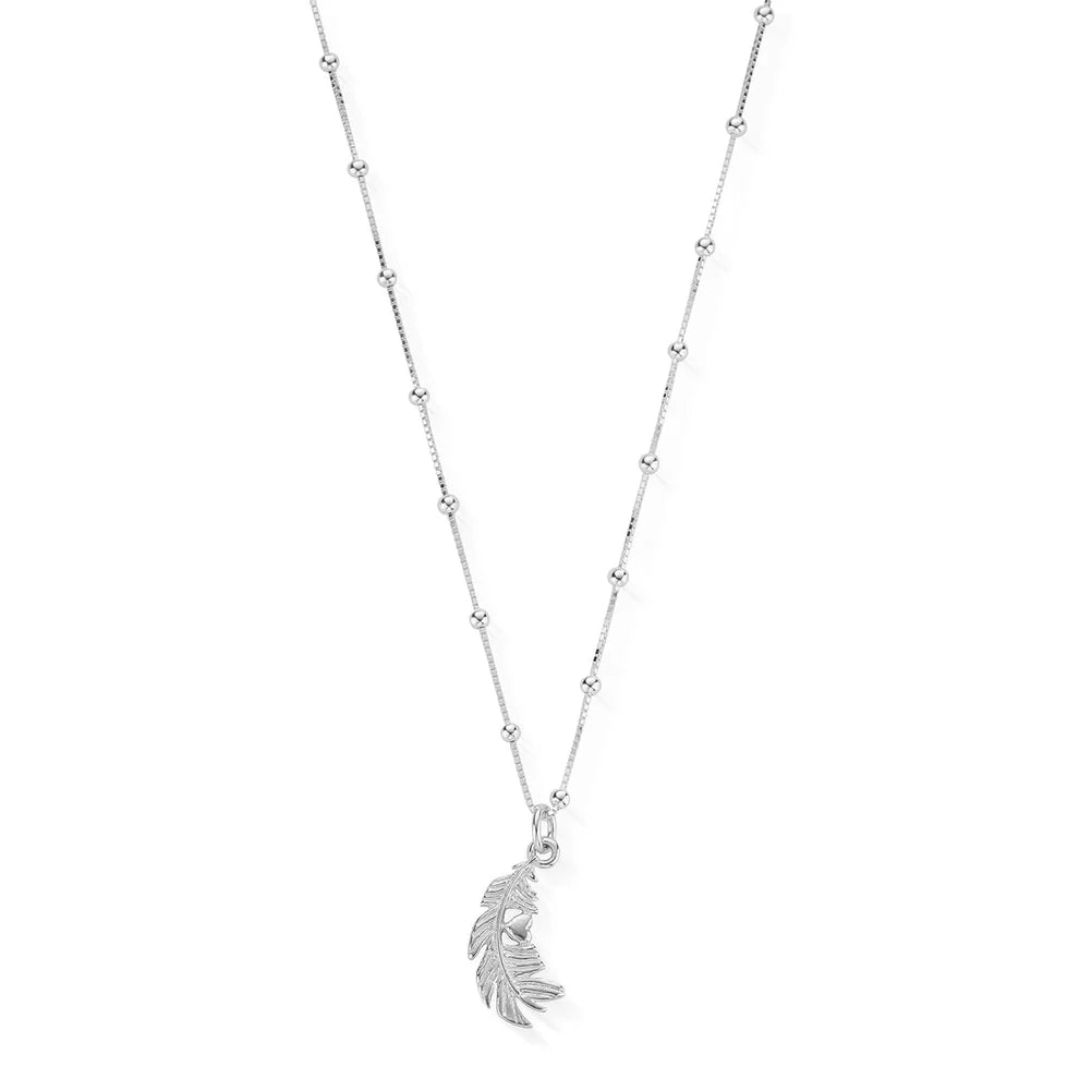 The ChloBo Bobble Chain Heart In Feather Necklace features a beaded silver chain with a feather and heart charm pendant, capturing the delicate grace reminiscent of a guardian angel necklace.