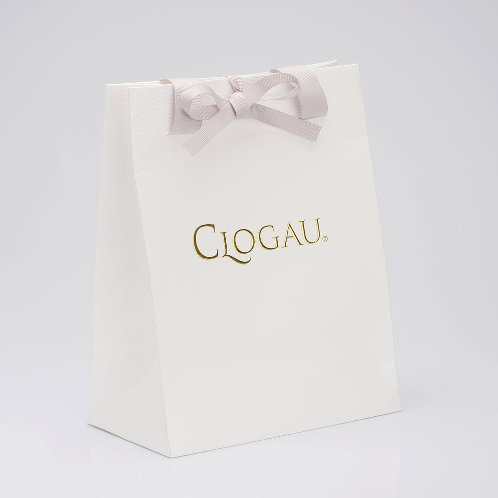 A white bag with the CLOGAU Tree of Life® Bangle TLB on it.