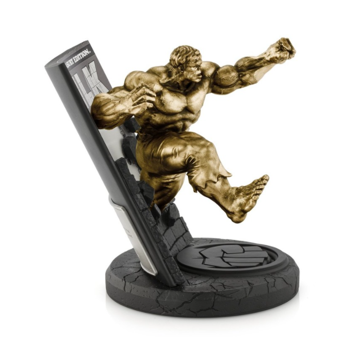 A statue of Hulk Marvel Treasury Edition Limited Edition Gilt #5 holding a phone.