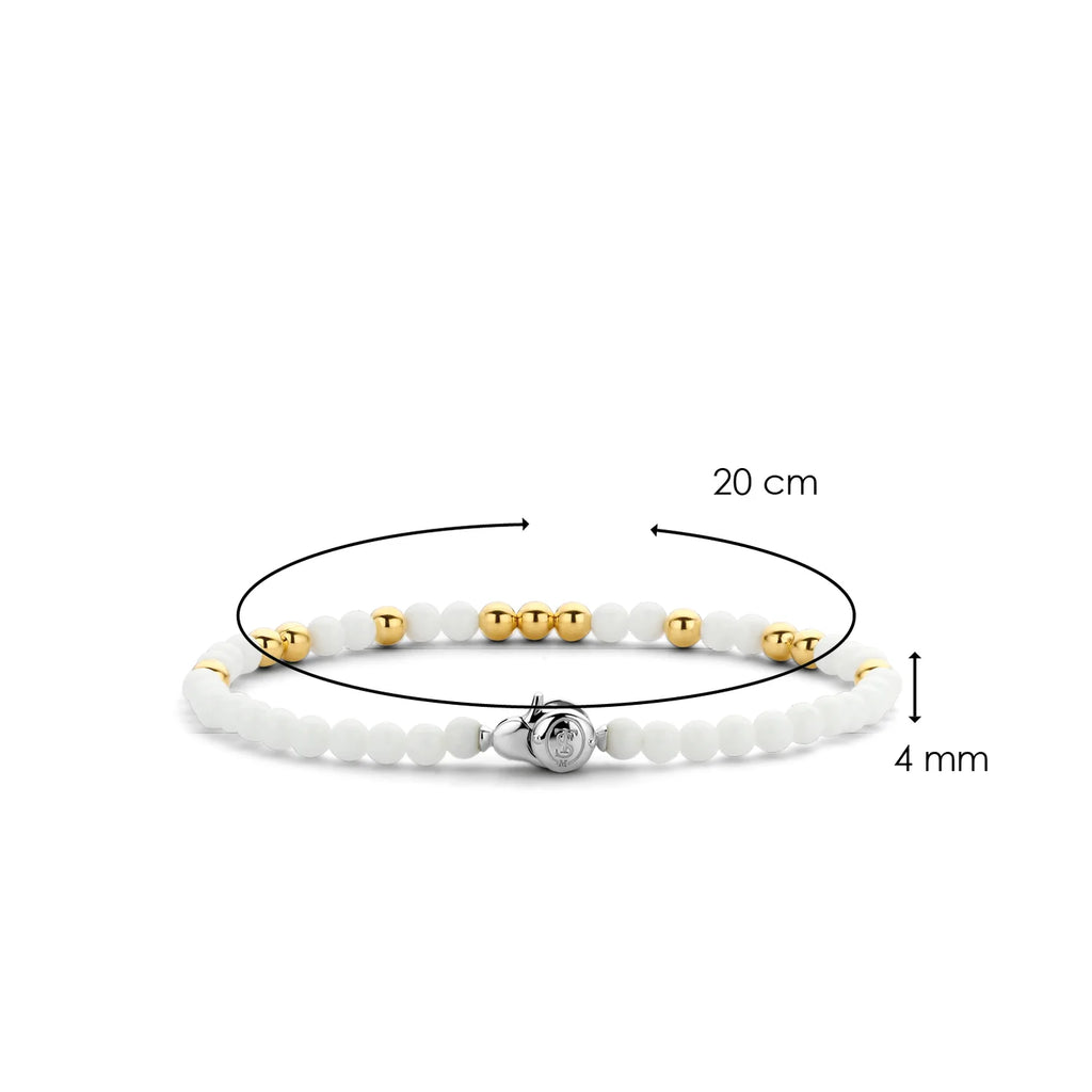 A TI SENTO – Milano Stacking Bracelet 2908WY with a gold bead and a white bead.