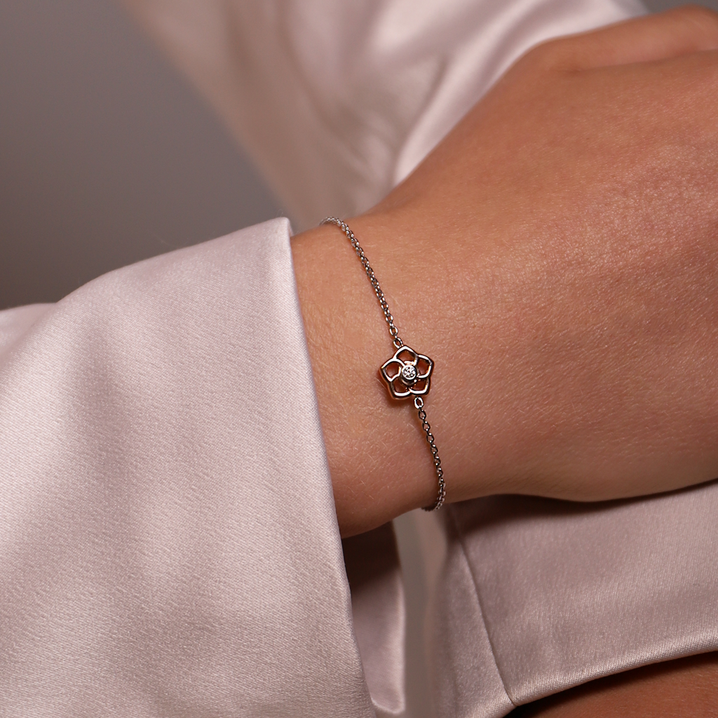 A woman wearing a TI SENTO Milano bracelet with a diamond on it.