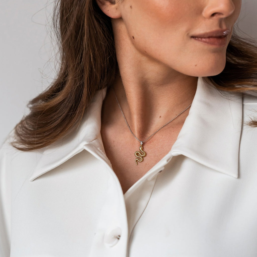 A woman wearing a white shirt with a TI SENTO Milano Snake Necklace 3923SY.