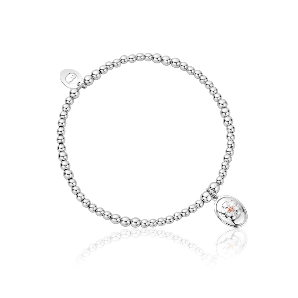 A Clogau Forget Me Not Affinity Bracelet 3SAFF0622 with a heart charm.