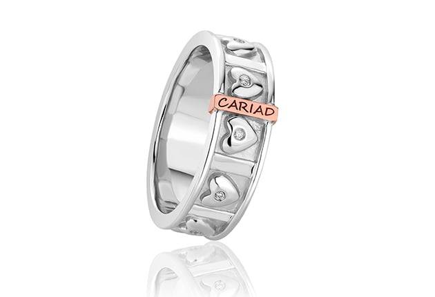 A Clogau Cariad Ring. 3SCARDBR with the word calais.