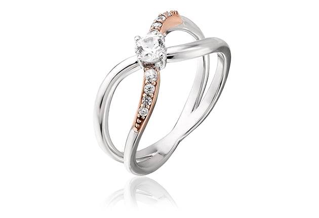 A Clogau® Kiss Ring 3SCGKR with a diamond.