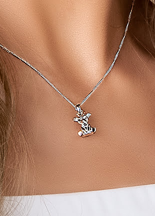 A woman is wearing a necklace with a Clogau Ciwt Deer Pendant 3SCL0114.