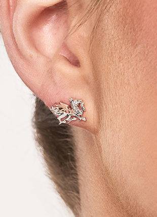 A woman's ear with Clogau Welsh Dragon Stud Earrings 3SD005SE.