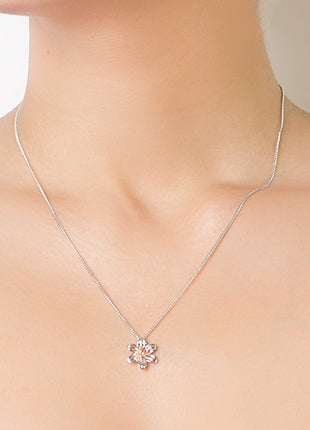 A woman wearing a Clogau Daffodil Pendant 3SDP3 necklace.
