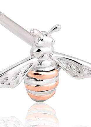 A silver and rose gold Clogau Honey Bee Earrings 3SHNBE piercing.
