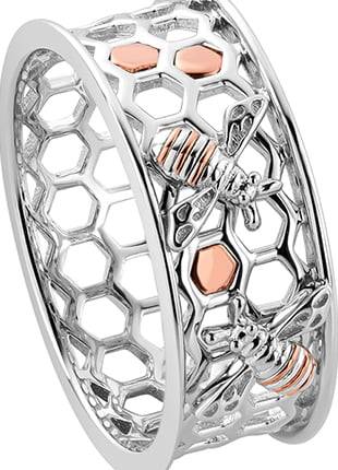 A silver and rose gold Clogau Honey Bee Honeycomb Ring 3SHNBWR with bees on it.